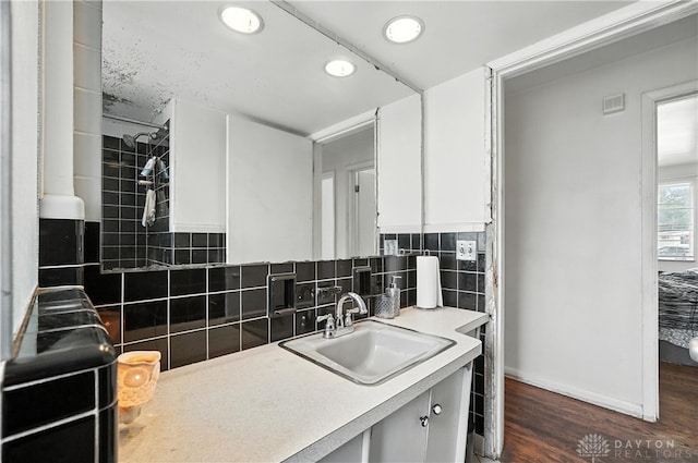 6101 Capri Dr, Cincinnati, OH 45224 - kitchen with dark wood-type flooring, white cabinetry, backsplash, recessed lighting, and light countertops