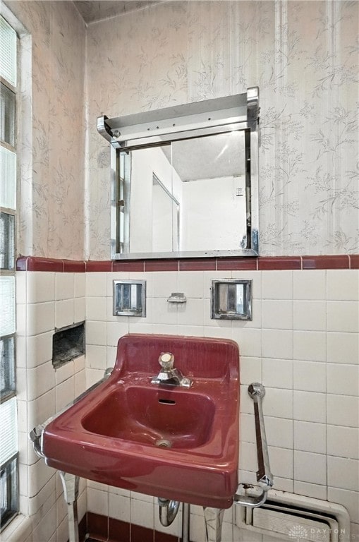 6101 Capri Dr, Cincinnati, OH 45224 - bathroom featuring wallpapered walls, tile walls, and wainscoting