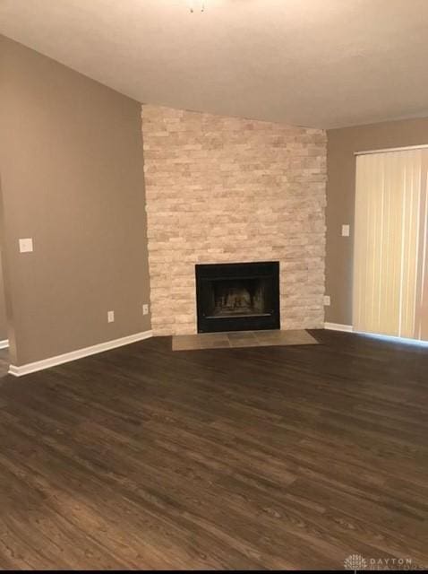 1411 Lake Pointe Way Unit 8, Washington Twp, OH 45459 - unfurnished living room featuring dark wood-style floors and a fireplace