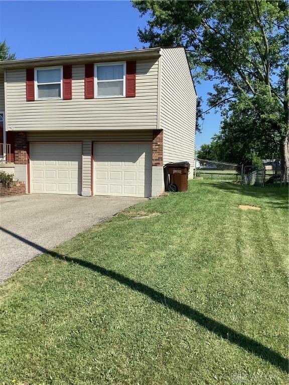 150 Lexington Farm Rd, Englewood, OH 45322 - view of front of house with a garage, brick siding, and driveway