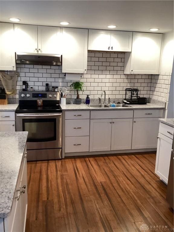 150 Lexington Farm Rd, Englewood, OH 45322 - kitchen with electric range, range hood, tasteful backsplash, and white cabinets