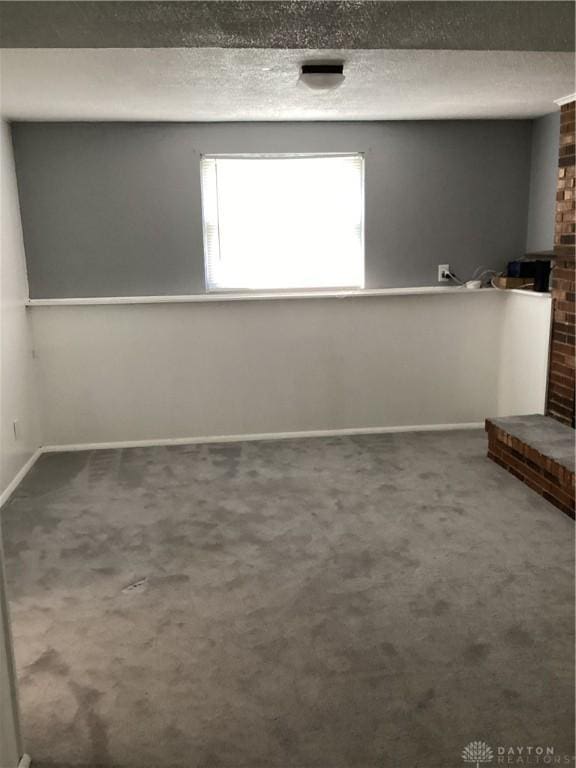 150 Lexington Farm Rd, Englewood, OH 45322 - spare room with carpet flooring and a brick fireplace