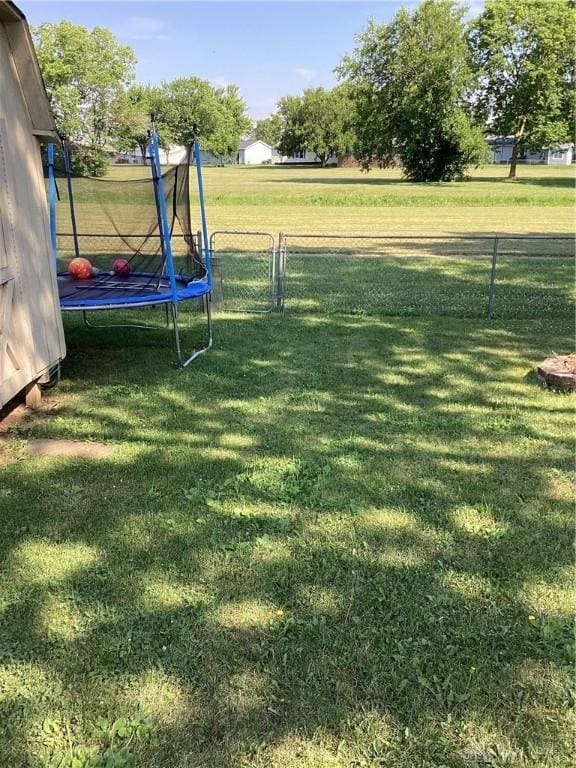 150 Lexington Farm Rd, Englewood, OH 45322 - view of yard featuring a trampoline