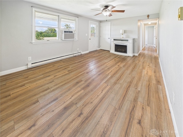 3862 State Route 49, Arcanum, OH 45304 - unfurnished living room with a baseboard heating unit, ceiling fan, light wood finished floors, cooling unit, and a fireplace