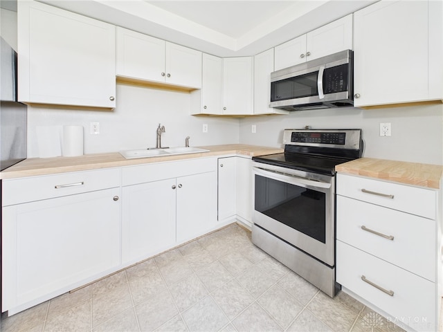 3862 State Route 49, Arcanum, OH 45304 - kitchen featuring appliances with stainless steel finishes, white cabinets, and light countertops