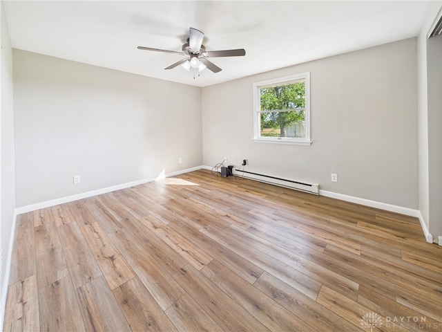 3862 State Route 49, Arcanum, OH 45304 - empty room featuring a baseboard radiator, ceiling fan, and light wood-style floors