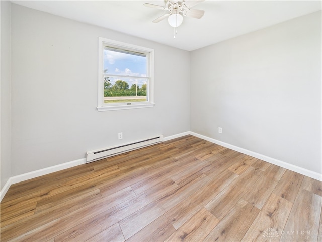 3862 State Route 49, Arcanum, OH 45304 - empty room with a baseboard heating unit, light wood-style floors, and ceiling fan