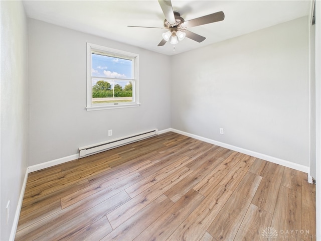 3862 State Route 49, Arcanum, OH 45304 - unfurnished room featuring baseboard heating, ceiling fan, and hardwood / wood-style floors