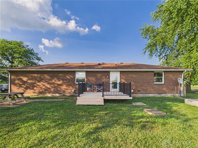 3862 State Route 49, Arcanum, OH 45304 - back of property featuring a lawn, a wooden deck, and brick siding