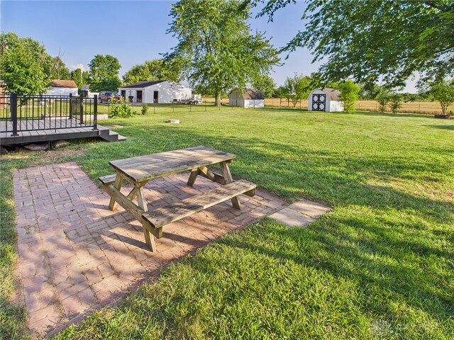 3862 State Route 49, Arcanum, OH 45304 - fenced backyard featuring a shed, a patio, a wooden deck, and outdoor dining space