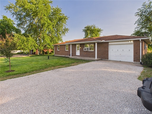 3862 State Route 49, Arcanum, OH 45304 - ranch-style home featuring an attached garage, driveway, a front lawn, and brick siding