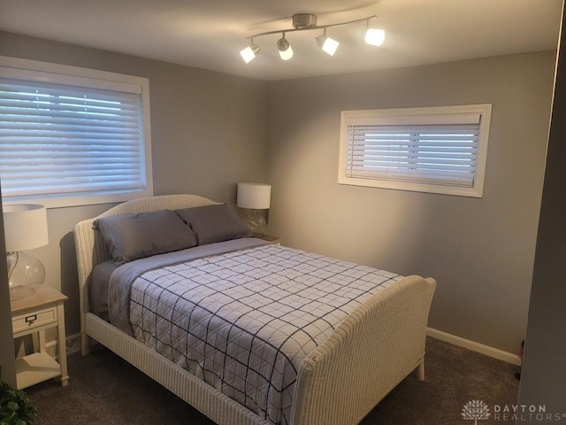 612 E Market St, Xenia, OH 45385 - bedroom with dark colored carpet and baseboards