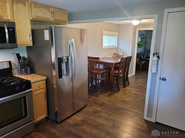 612 E Market St, Xenia, OH 45385 - kitchen with appliances with stainless steel finishes, dark wood-type flooring, light brown cabinets, and light countertops