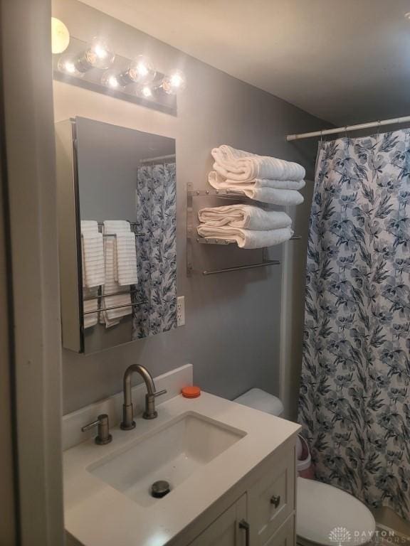612 E Market St, Xenia, OH 45385 - full bathroom featuring vanity and a shower with shower curtain