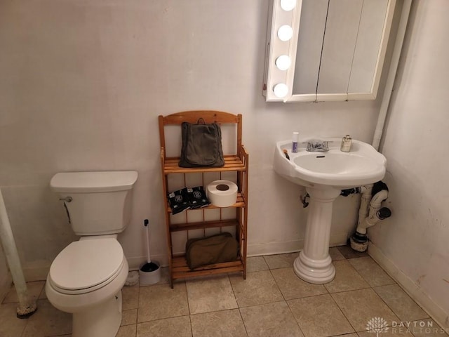 612 E Market St, Xenia, OH 45385 - bathroom featuring toilet and tile patterned floors