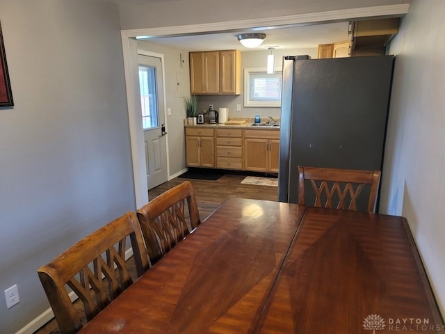 612 E Market St, Xenia, OH 45385 - dining space featuring dark wood-style floors and baseboards