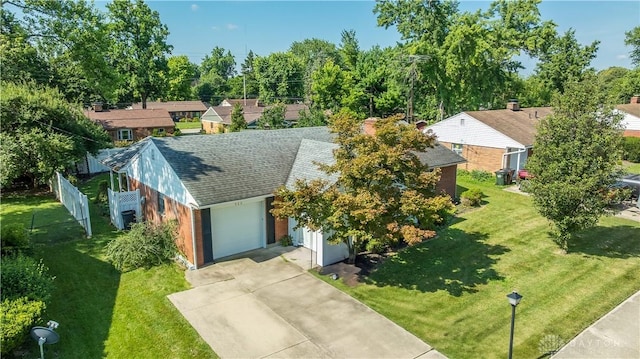 928 E Stroop Rd, Kettering, OH 45429 - view of front facade featuring a shingled roof, concrete driveway, and a garage