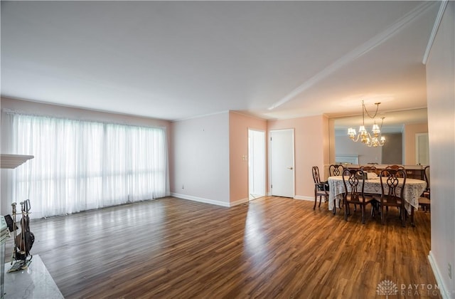 928 E Stroop Rd, Kettering, OH 45429 - living room with dark wood-type flooring and a chandelier
