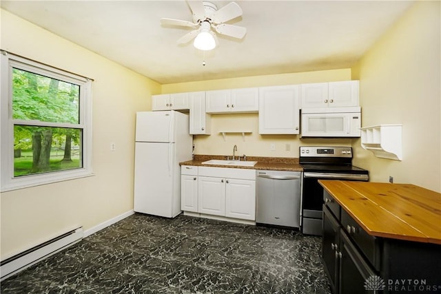 291 Schlitz Dr, Fayetteville, OH 45118 - kitchen with appliances with stainless steel finishes, a baseboard radiator, wood counters, and white cabinetry
