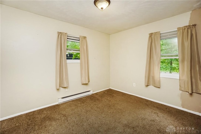 291 Schlitz Dr, Fayetteville, OH 45118 - carpeted empty room with a baseboard heating unit and baseboards