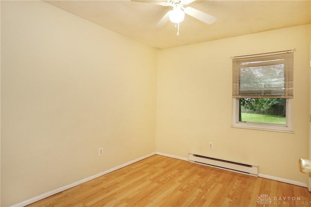 291 Schlitz Dr, Fayetteville, OH 45118 - spare room with a baseboard heating unit, light wood-style floors, and ceiling fan