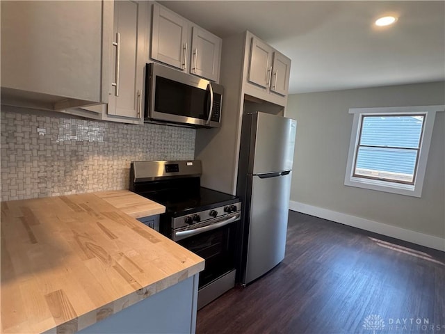 2627 Wayland Ave, Dayton, OH 45420 - kitchen with stainless steel appliances, wood counters, decorative backsplash, dark wood-style floors, and recessed lighting