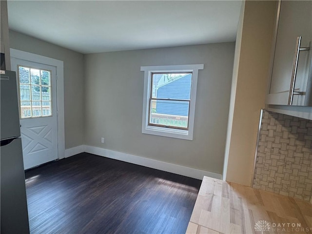 2627 Wayland Ave, Dayton, OH 45420 - unfurnished dining area featuring healthy amount of natural light and dark wood-style floors