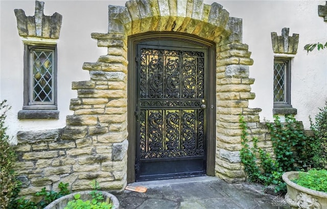 715 E Schantz Ave, Oakwood, OH 45419 - doorway to property featuring stone siding and stucco siding
