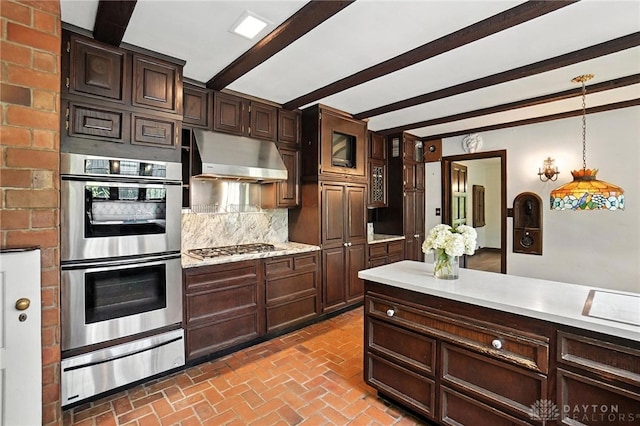 715 E Schantz Ave, Oakwood, OH 45419 - kitchen featuring stainless steel appliances, exhaust hood, a warming drawer, beamed ceiling, and light countertops
