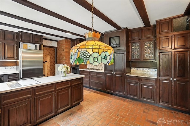 715 E Schantz Ave, Oakwood, OH 45419 - kitchen with stainless steel appliances, light countertops, brick flooring, beam ceiling, and tasteful backsplash