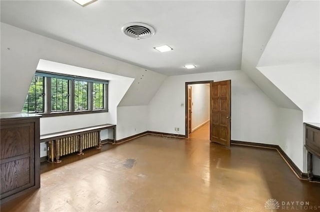 715 E Schantz Ave, Oakwood, OH 45419 - bonus room with radiator, finished concrete floors, and lofted ceiling