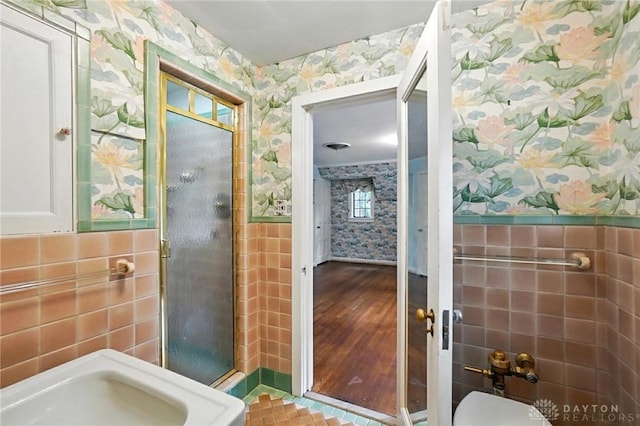 715 E Schantz Ave, Oakwood, OH 45419 - full bath featuring wallpapered walls, tile walls, a stall shower, and wainscoting