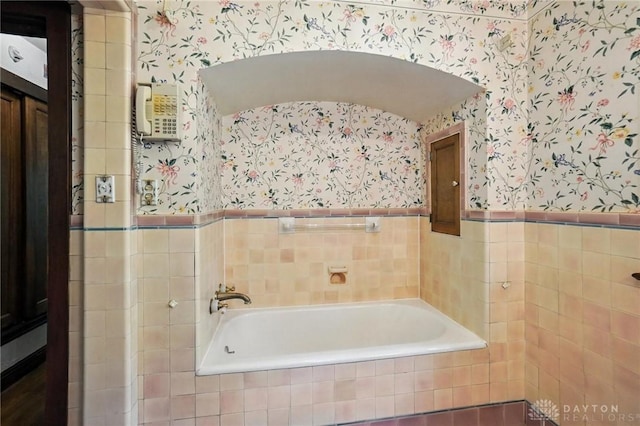 715 E Schantz Ave, Oakwood, OH 45419 - full bath with wallpapered walls, a bath, wainscoting, and tile walls
