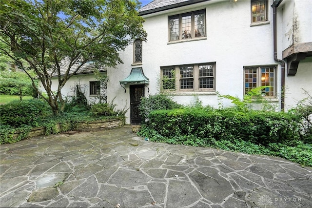 715 E Schantz Ave, Oakwood, OH 45419 - tudor house featuring stucco siding and a patio area