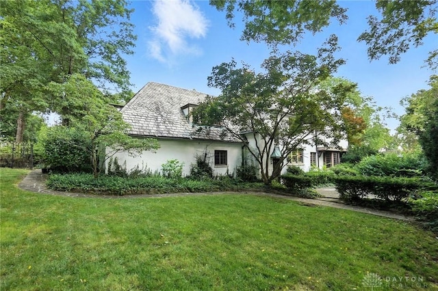 715 E Schantz Ave, Oakwood, OH 45419 - back of house with stucco siding and a lawn