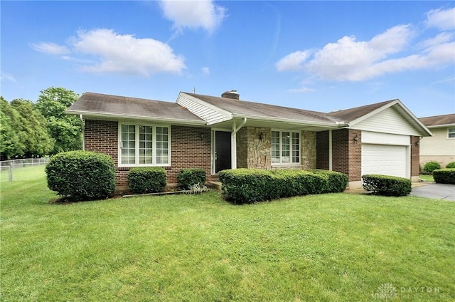 2042 Hilltop Rd, Xenia, OH 45385 - single story home with a garage, brick siding, concrete driveway, and a chimney