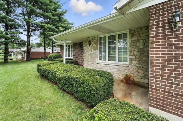 2042 Hilltop Rd, Xenia, OH 45385 - view of side of home with stone siding and a yard