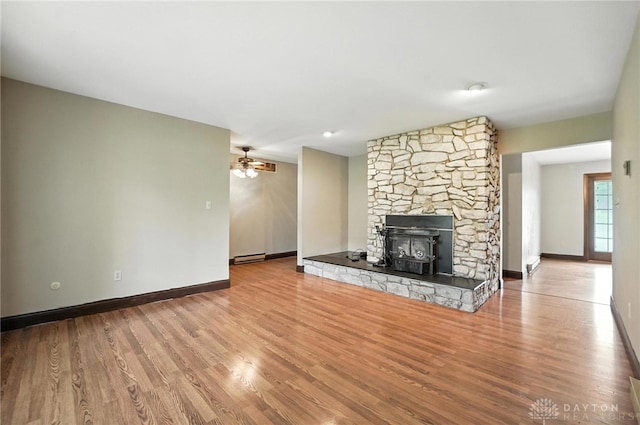2042 Hilltop Rd, Xenia, OH 45385 - unfurnished living room with wood finished floors and a ceiling fan