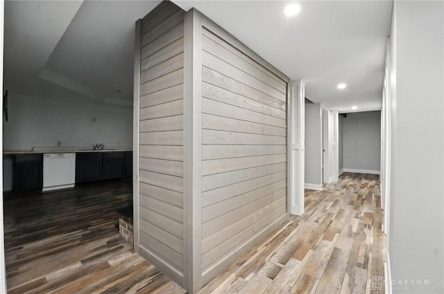 2042 Hilltop Rd, Xenia, OH 45385 - hallway featuring recessed lighting, wood finished floors, and wood walls
