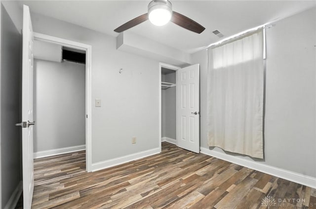 2042 Hilltop Rd, Xenia, OH 45385 - unfurnished bedroom featuring wood finished floors, ceiling fan, and a closet