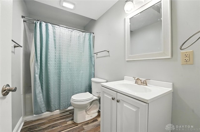 2042 Hilltop Rd, Xenia, OH 45385 - bathroom with wood finished floors, vanity, and shower / bath combo