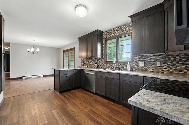 2042 Hilltop Rd, Xenia, OH 45385 - kitchen with baseboard heating, dishwasher, a chandelier, backsplash, and a peninsula