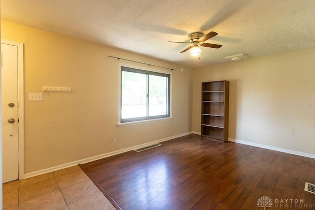 27 Hillview Ave, Miamisburg, OH 45342 - empty room featuring a ceiling fan, a textured ceiling, and wood finished floors