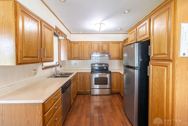 27 Hillview Ave, Miamisburg, OH 45342 - kitchen with stainless steel appliances, under cabinet range hood, dark wood finished floors, decorative backsplash, and light countertops