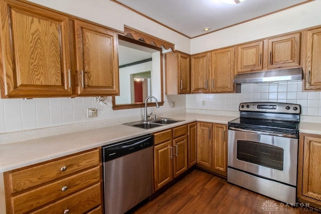 27 Hillview Ave, Miamisburg, OH 45342 - kitchen featuring stainless steel appliances, under cabinet range hood, brown cabinetry, and ornamental molding