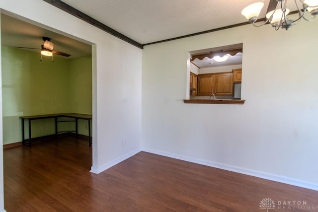 27 Hillview Ave, Miamisburg, OH 45342 - spare room featuring dark wood-style floors, a chandelier, a ceiling fan, and crown molding