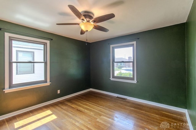 27 Hillview Ave, Miamisburg, OH 45342 - unfurnished room featuring healthy amount of natural light, wood finished floors, and a ceiling fan