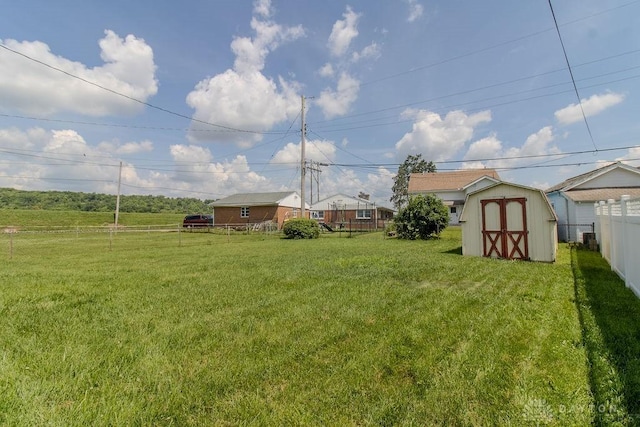 27 Hillview Ave, Miamisburg, OH 45342 - fenced backyard with a storage unit