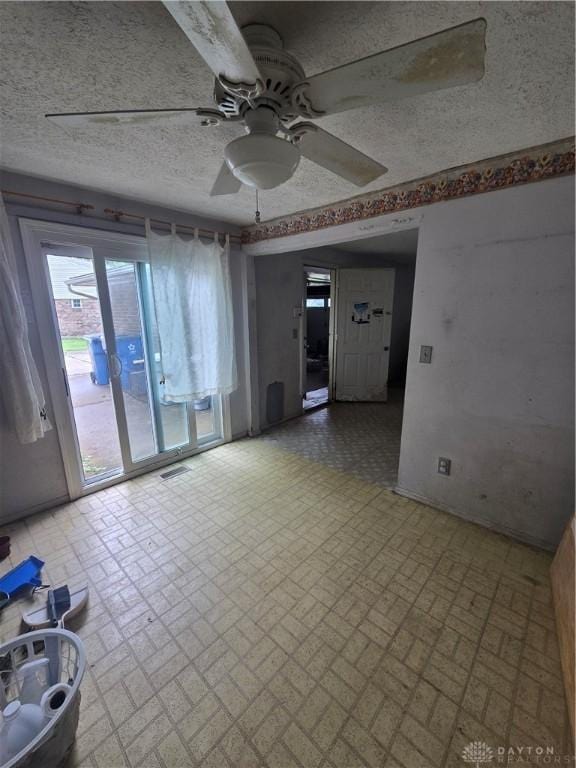 4801 Creeknoll Ct, Dayton, OH 45424 - empty room featuring brick patterned flooring, a ceiling fan, and a textured ceiling