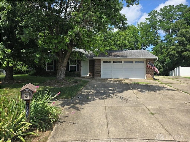 4801 Creeknoll Ct, Dayton, OH 45424 - view of front of home featuring driveway, a garage, and brick siding